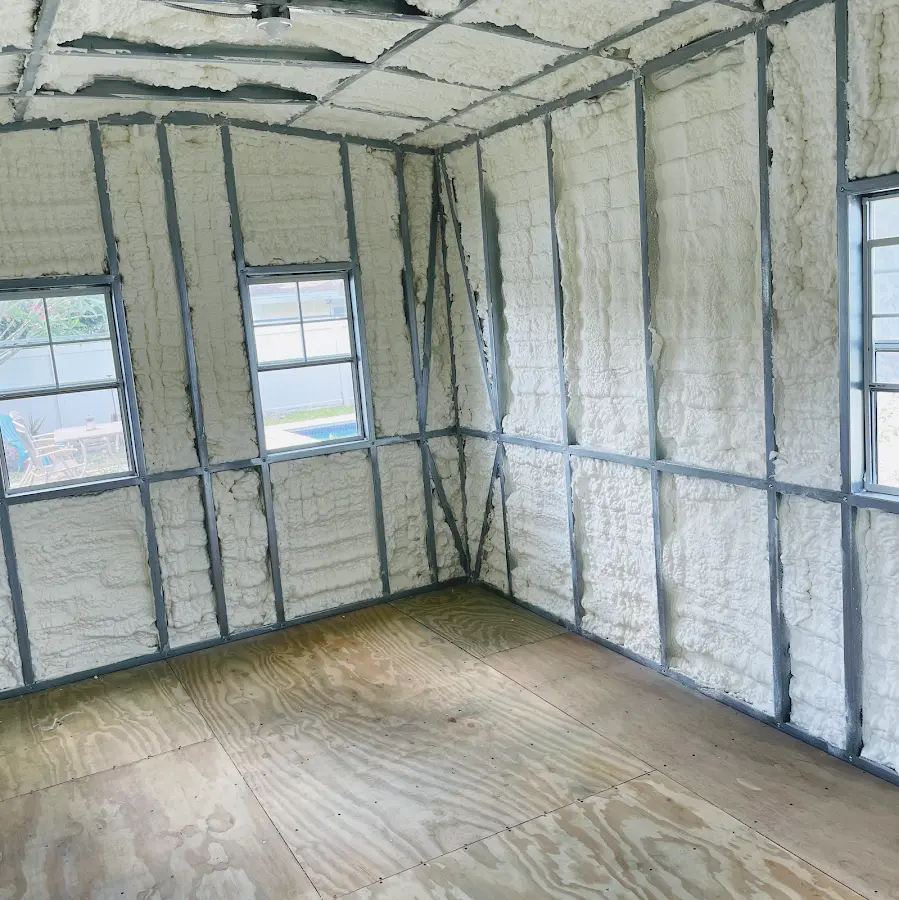 Closed-cell spray foam insulation applied to wall cavities in a residential project in St. Albans